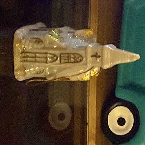 A Small Glass Church White Decorated With Golden Glitter